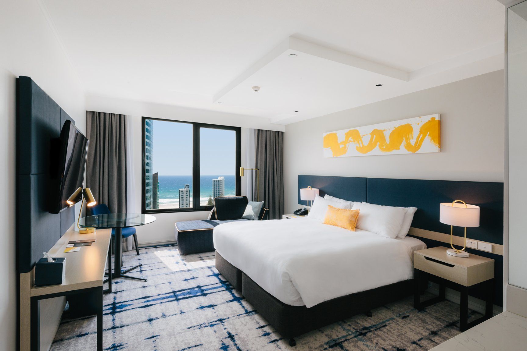 Glimpse views of the Pacific Ocean from our Deluxe King room